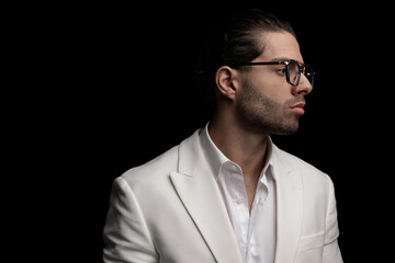 sexy man with glasses wearing open collar shirt and looking to side