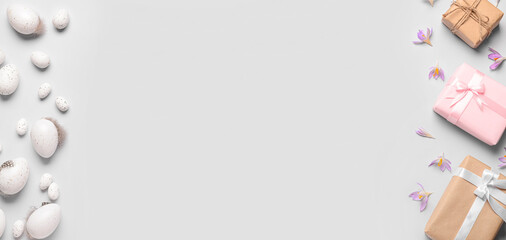 Gifts, Easter eggs and flowers on light background with space for text