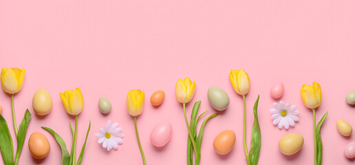 Easter eggs and flowers on pink background