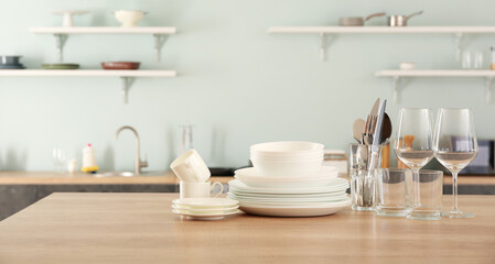 Set of clean dishes on kitchen table