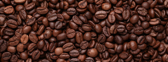 Closeup view of roasted coffee beans as background