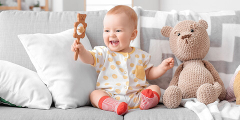 Happy little baby with toys at home - obrazy, fototapety, plakaty