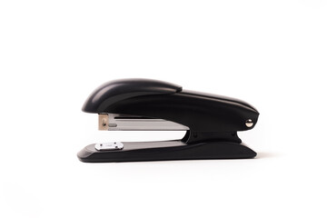 a dark metal stapler. close-up. on a white background.