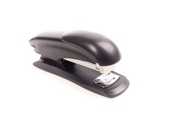 a dark metal stapler. close-up. on a white background.