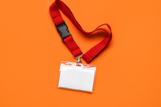 Blank badge with red neck lanyard on color background - Powered by Adobe