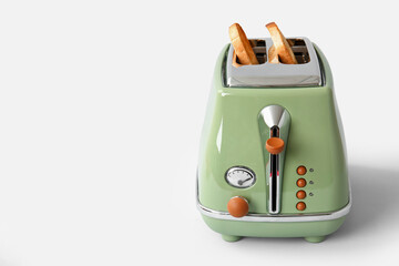 Modern toaster with crispy bread slices isolated on white background