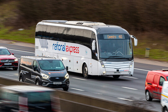 Redbourn, UK - March 11, 2023: National express bus traveling on the British motorway M1