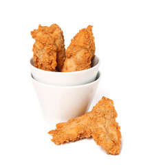 Bowl of tasty nuggets on white background