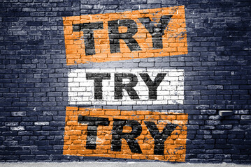 Try try try saying lettering Graffiti on Brick Wall