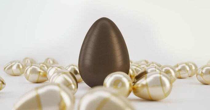 Easter eggs falling on the table. Chocolate eggs. Easter.