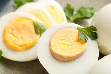 Delicious boiled eggs with parsley on plate, closeup