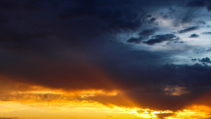 sunset clouds with orange rays