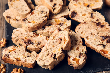 Board with delicious biscotti cookies, closeup