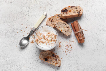 Delicious biscotti cookies, cinnamon and cup of coffee on white grunge background