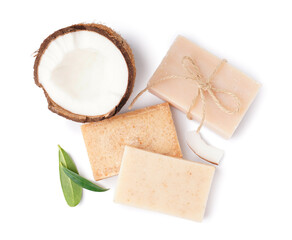 Natural soap bars and coconut on white background