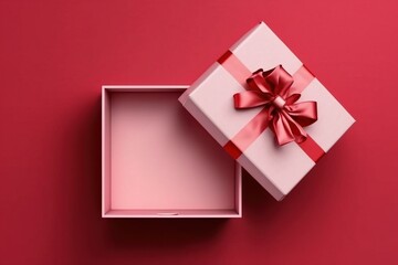 open gift box with pink bow on pink background