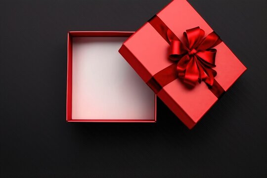 Open Gift Box With Red Bow On Black Background