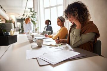Businesswoman and colleagues working in an office