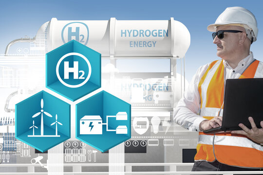 Hydrogen industry. Engineer man of energy company. H2 and windmills logo. Man of hydrogen manufacturing technique. Equipment with inscription hydrogen energy. H2 fuel. Ecological, clean, green