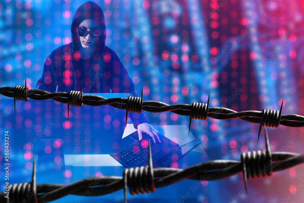 Poster barbed wire and hacker. arrest of cyber criminal. hacker in hood. man with computers in neon light. 