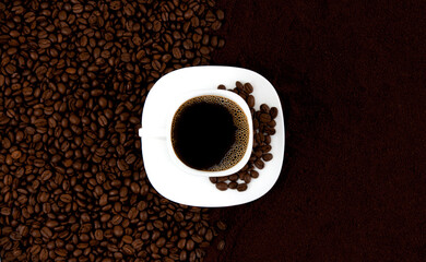 Coffee background. A cup of coffee on a background of coffee beans and ground coffee. Concept of freshly ground coffee.