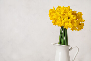 Vase with narcissus flowers on white background, closeup