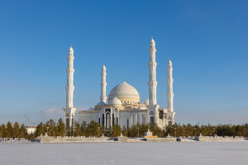 Panoramic view of snow-white modern Hazaret Sultan mosque sunny morning, Nur-Sultan, Astana,...
