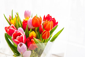 a bouquet of tulips of different colors
