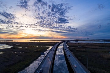 Aerial view of interstate 10 bridge on Mobile Bay at sunset