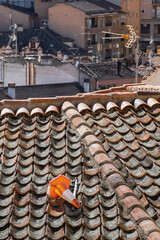 Out of place. 
Traffic cone in a roof. 
Segovia, Spain