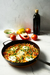 Moroccan Shakshuka. Mediterranean Goodness Shakshuka with Vibrant Colors and Bold Flavors. Breakfast dish with eggs peppers and tomatoes plus spices