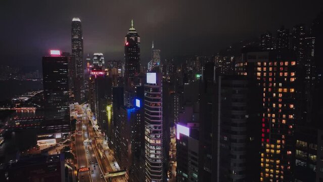 Night Highway And Bright Buildings Of Hong Kong, Aerial View
