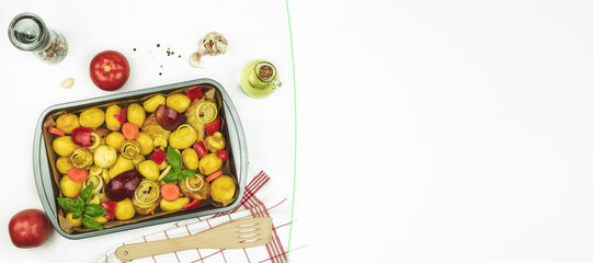 On a metal baking sheet of meat with spices