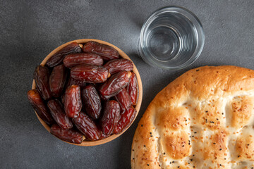 Date fruits,Ramadan pita and water,top view