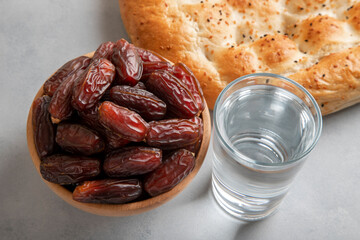 Date fruits,Ramadan pita and water,top view