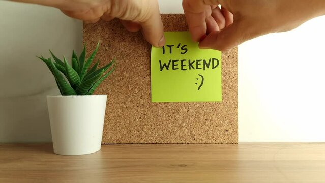 Paper note with text it`s weekend on cork bulletin board. Happy weekend concept