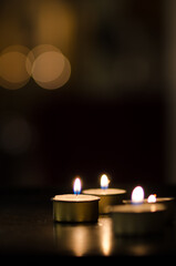 Small candles with dark background