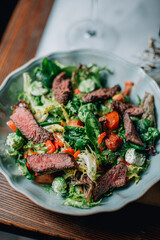 warm salad with herbs and vegetables with red wine