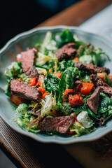 warm salad with herbs and vegetables with red wine