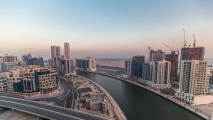 Skyscrapers at the Business Bay aerial evening timelapse in Dubai, United Arab Emirates