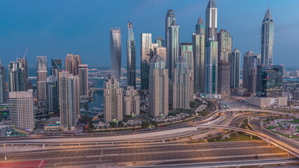 Fototapeta na wymiar Dubai Marina highway intersection spaghetti junction night to day timelapse