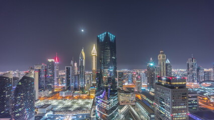 Obraz premium Panorama of futuristic skyscrapers in financial district business center in Dubai all night timelapse