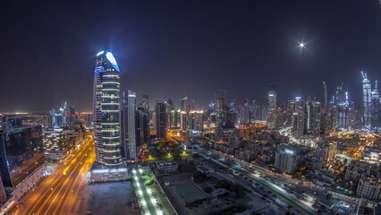 Obraz na płótnie Canvas Dubai's business bay towers aerial all night timelapse. Rooftop view of some skyscrapers