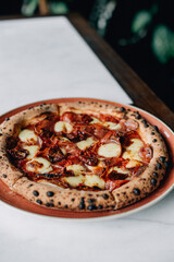 pepperoni pizza on a wood table with lives