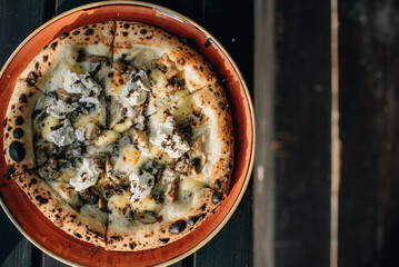 pizza with mushrooms on wood table