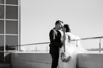 bride and groom first meeting on the roof of skyscraper