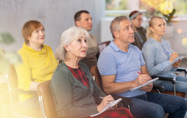 Elderly people study in the classroom on refresher courses