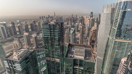 Fototapeta na wymiar Panorama showing Dubai Marina and JLT with JBR district. Ttraffic on highway between skyscrapers aerial timelapse.