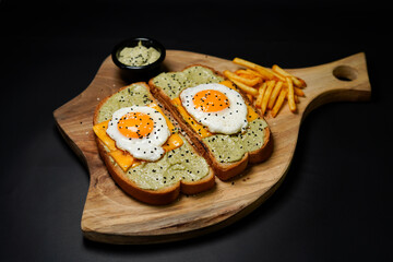 Egg with Avocado Toast isolated on black background