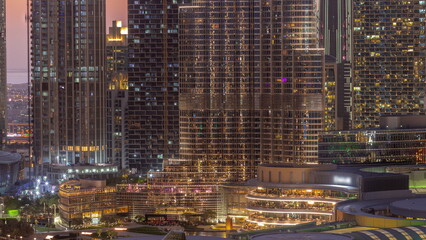 Shopping mall exterior with reastaurants day to night timelapse in Dubai, United Arab Emirates